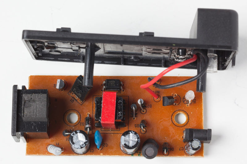 A lithium-ion battery mid-charge — charge-and-store habits that keep an underwater fishing camera alive across three seasons
