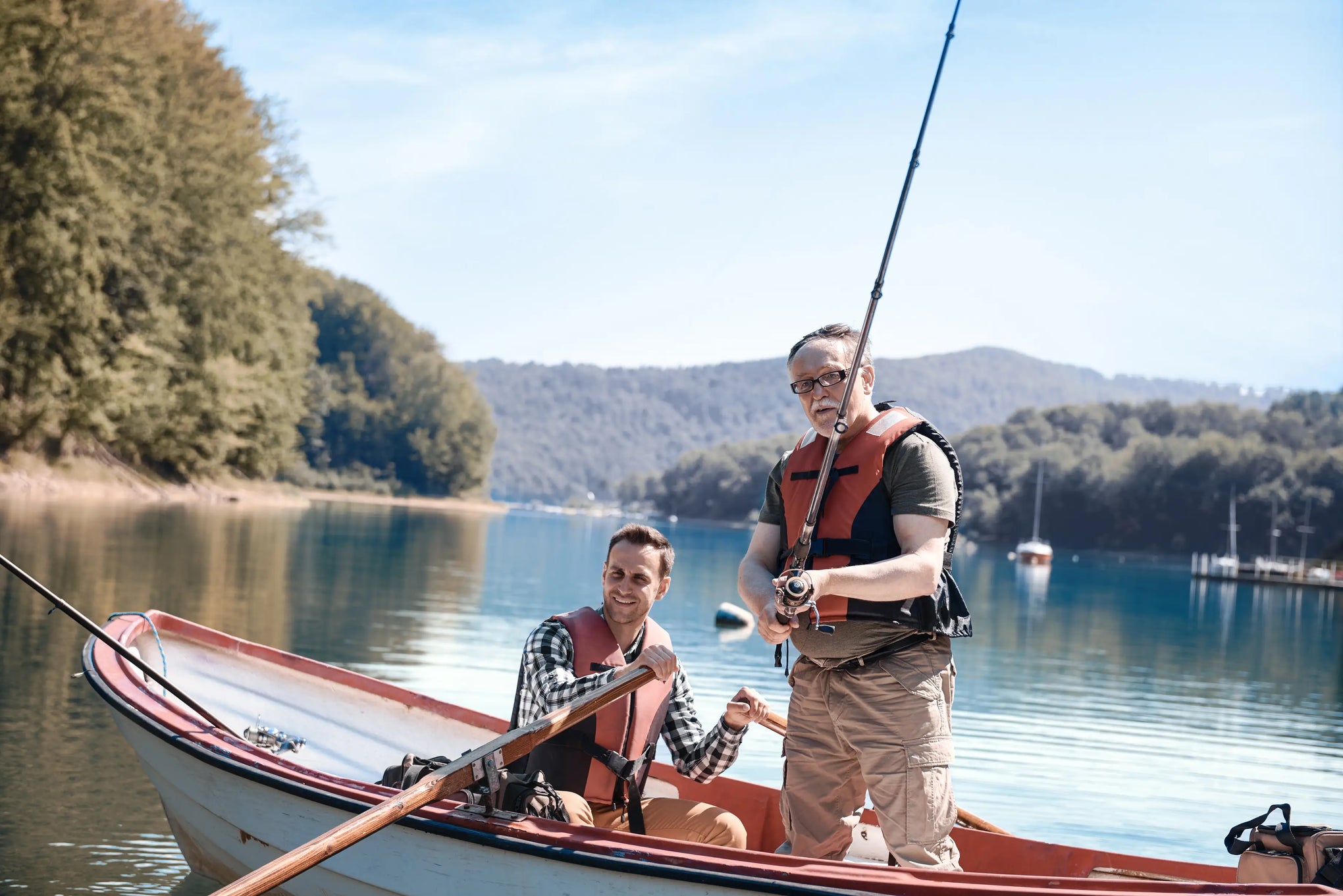 Anglers trolling from boat with Fisho CamX inline to capture salmon, sea-trout, and pike strikes in 1080p