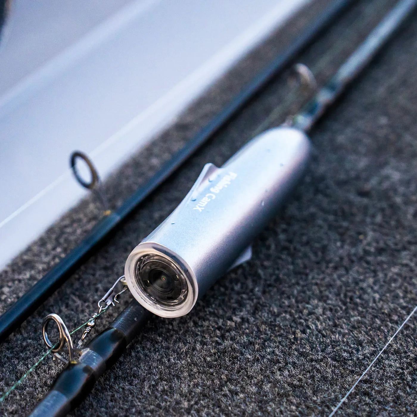 CanFish CamX clipped to the fishing line — works for casting, trolling, and float fishing
